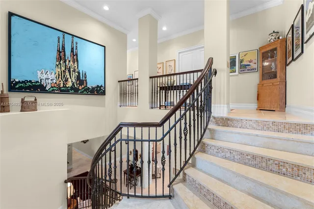 a balcony with furniture and a potted plant