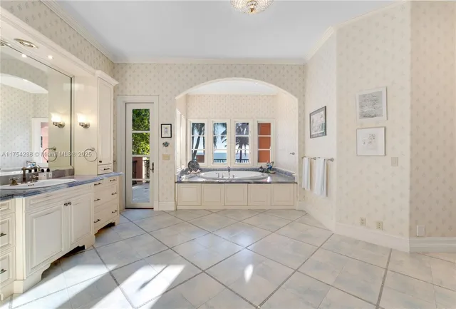 a spacious bedroom with a large bed and a couch