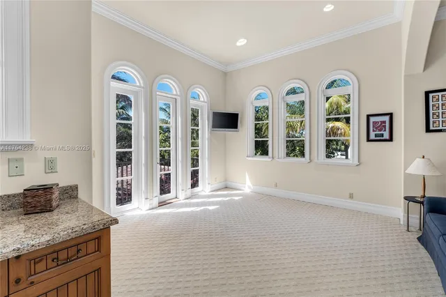 a view of a balcony with chair and wooden floor