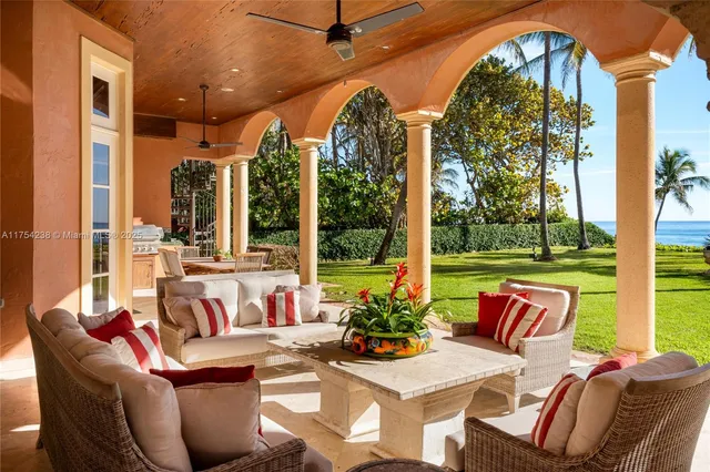a view of a swimming pool with a table and chairs