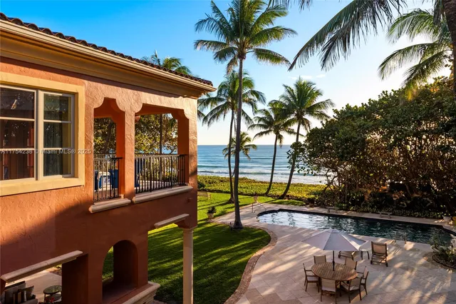 a view of a lake with a house in the background