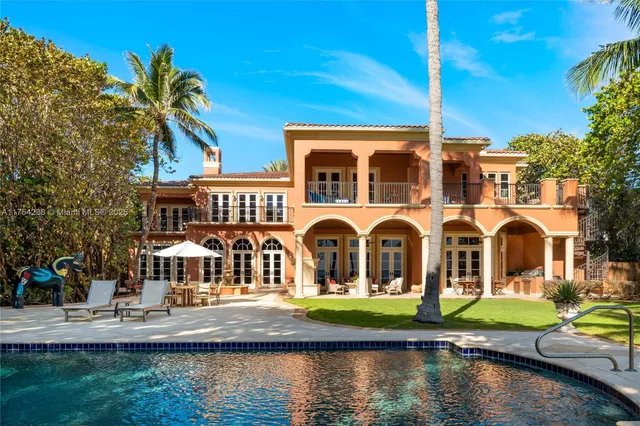 an aerial view of a house with a ocean view