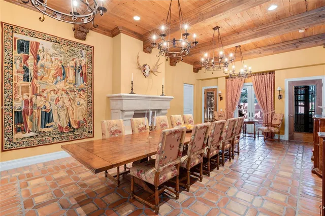 a living room with furniture and floor to ceiling window