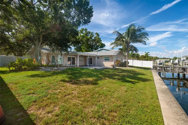 a view of house with a yard