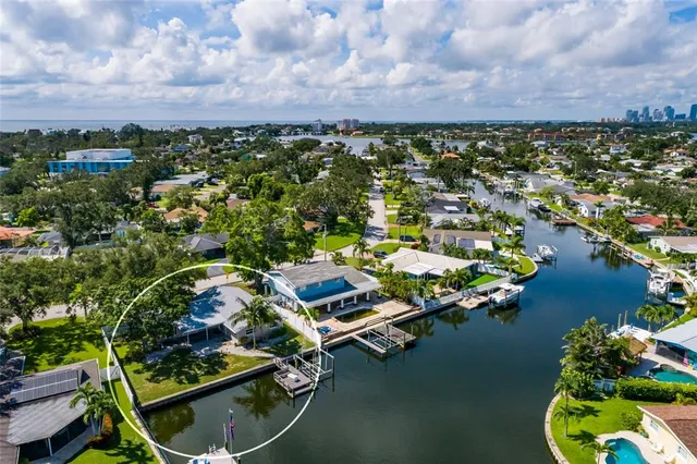 an aerial view of a house with a lake view