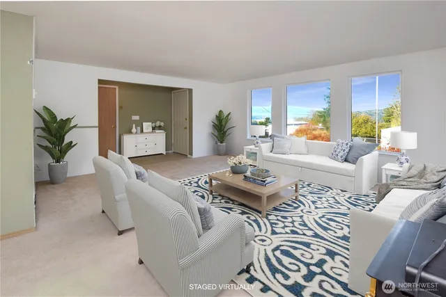 a living room with furniture potted plant a table and a potted plant