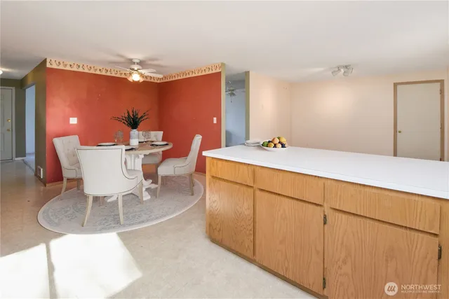 a dining room with furniture and wooden floor
