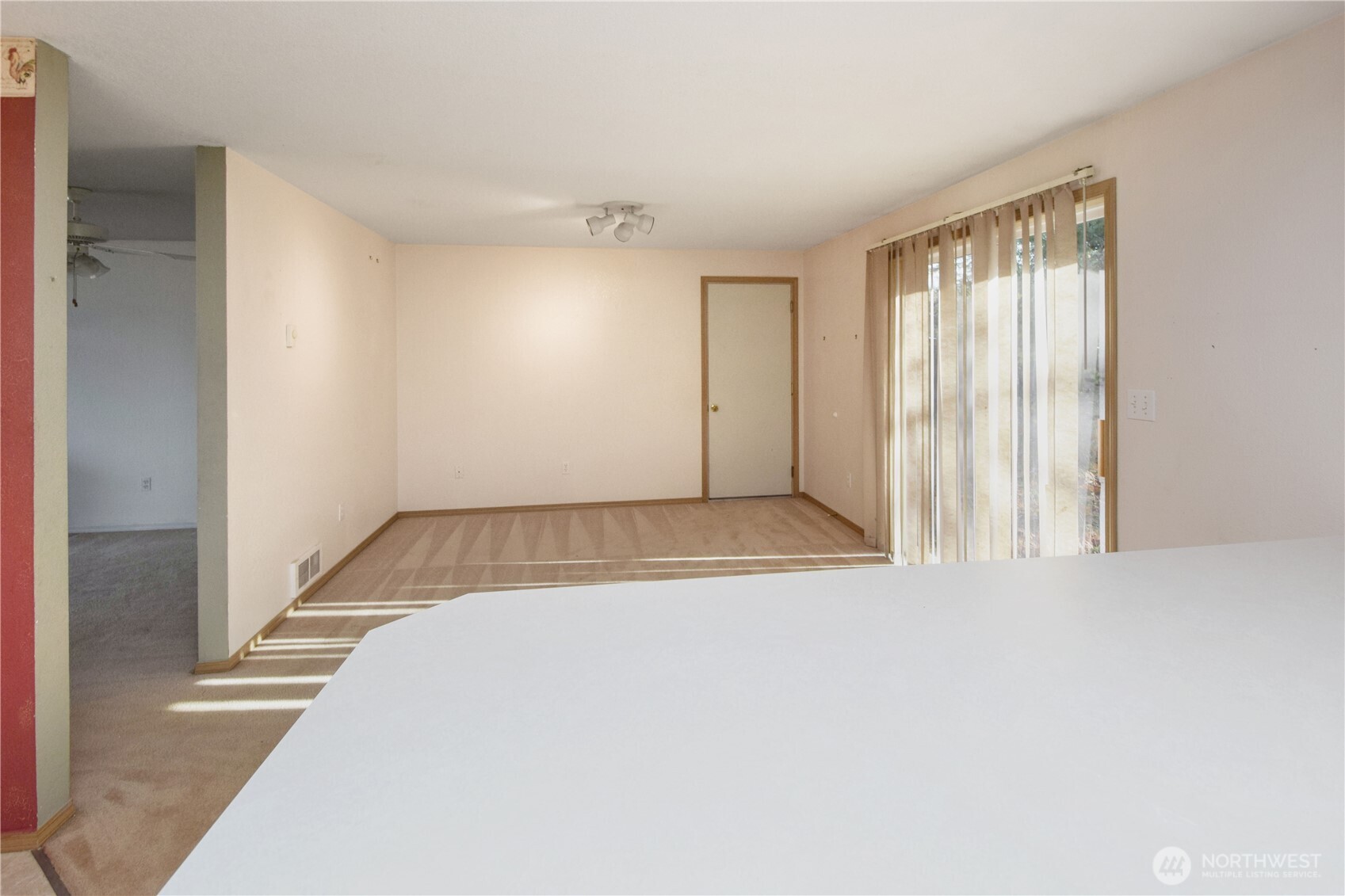 221 East 5th Street Union, WA 98592 - Photo 19 of 32 a view of an empty room with wooden floor and a window