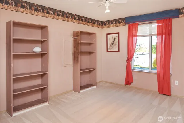 a view of an empty room with a window