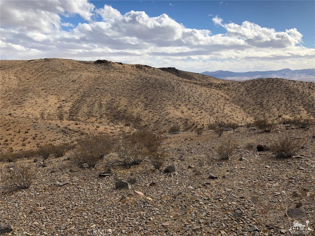 Cal Electric Road Barstow, CA 92311 - Photo 9 of 19 a view of a dry yard with mountains in the background
