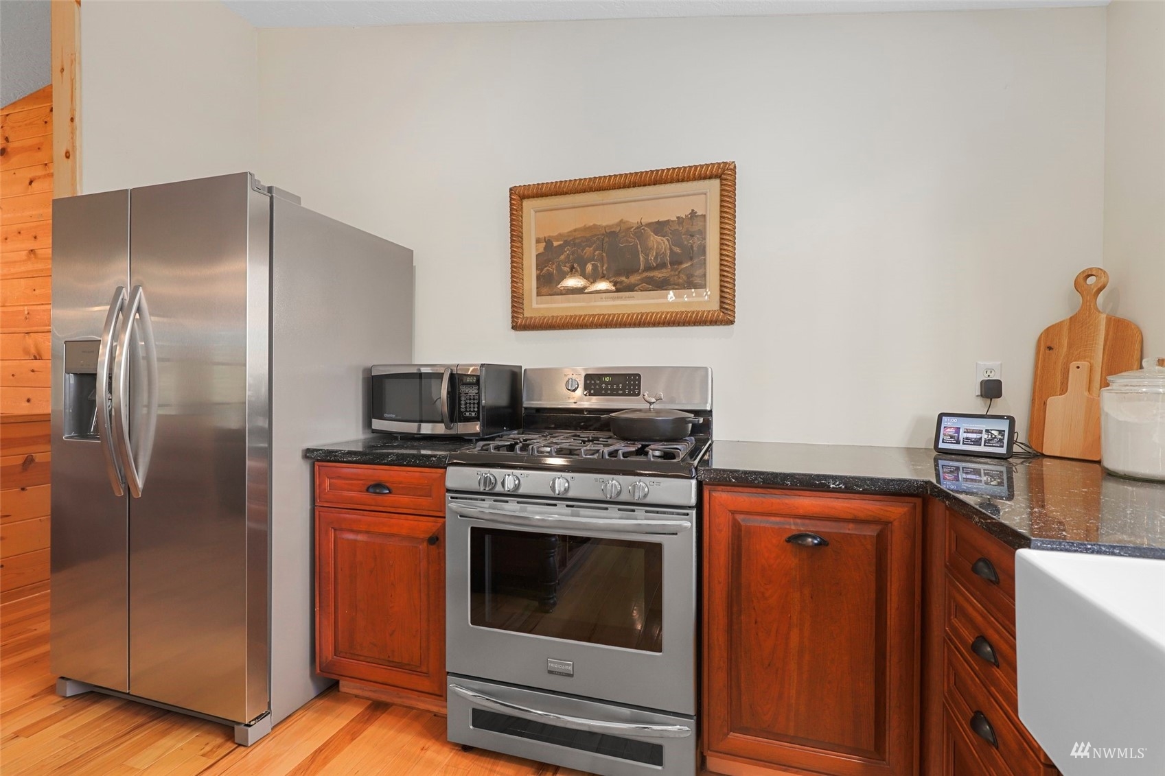 24301 23rd Avenue West Bothell, WA 98021 - Photo 11 of 39 a kitchen with stainless steel appliances granite countertop a stove and a refrigerator