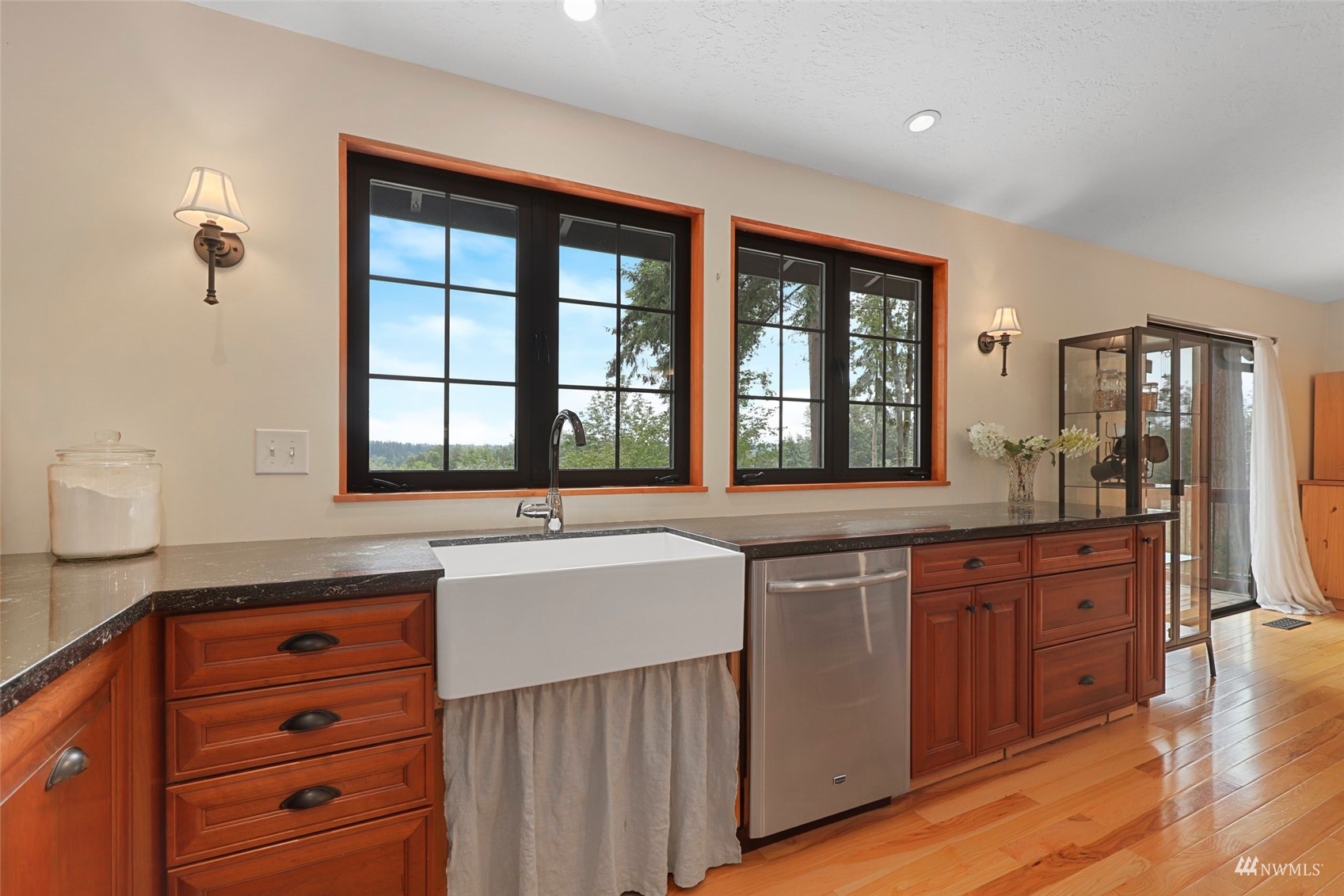 24301 23rd Avenue West Bothell, WA 98021 - Photo 12 of 39 a kitchen with stainless steel appliances granite countertop a sink and cabinets