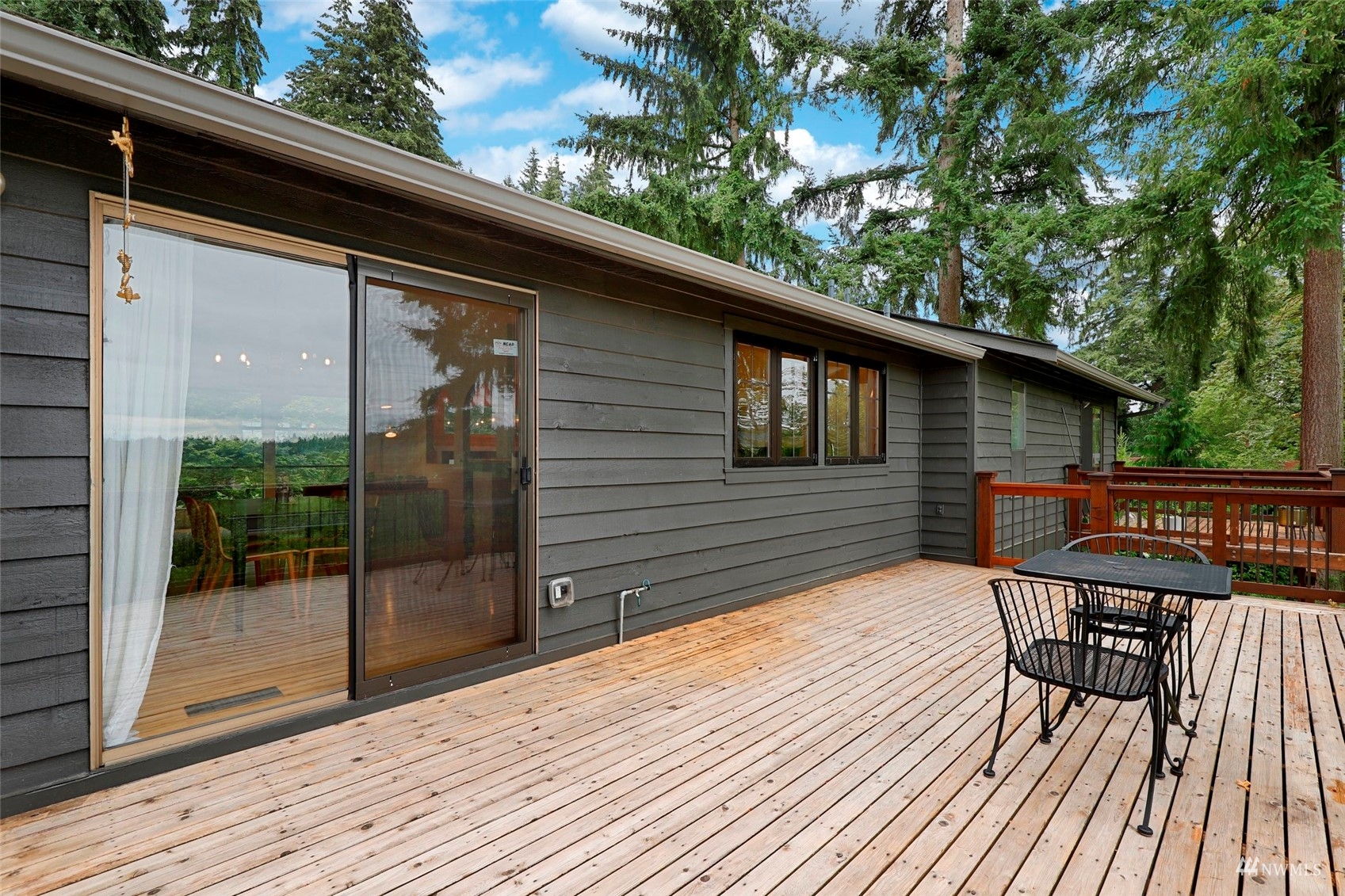 24301 23rd Avenue West Bothell, WA 98021 - Photo 14 of 39 a balcony with wooden floor table and chairs