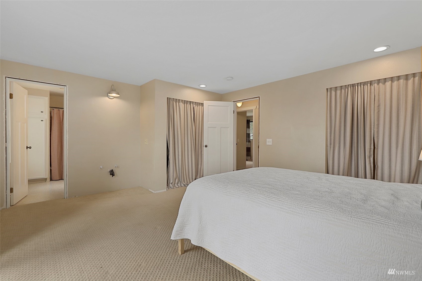 24301 23rd Avenue West Bothell, WA 98021 - Photo 17 of 39 a spacious bedroom with a bed and a window