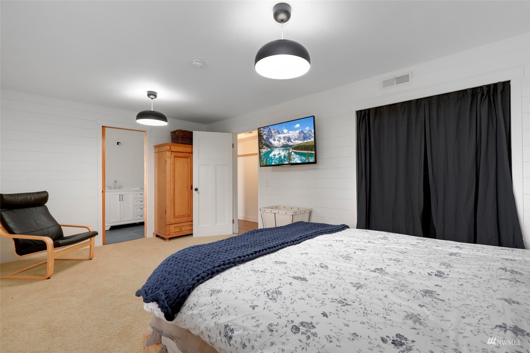 24301 23rd Avenue West Bothell, WA 98021 - Photo 22 of 39 a bedroom with a bed and cabinets
