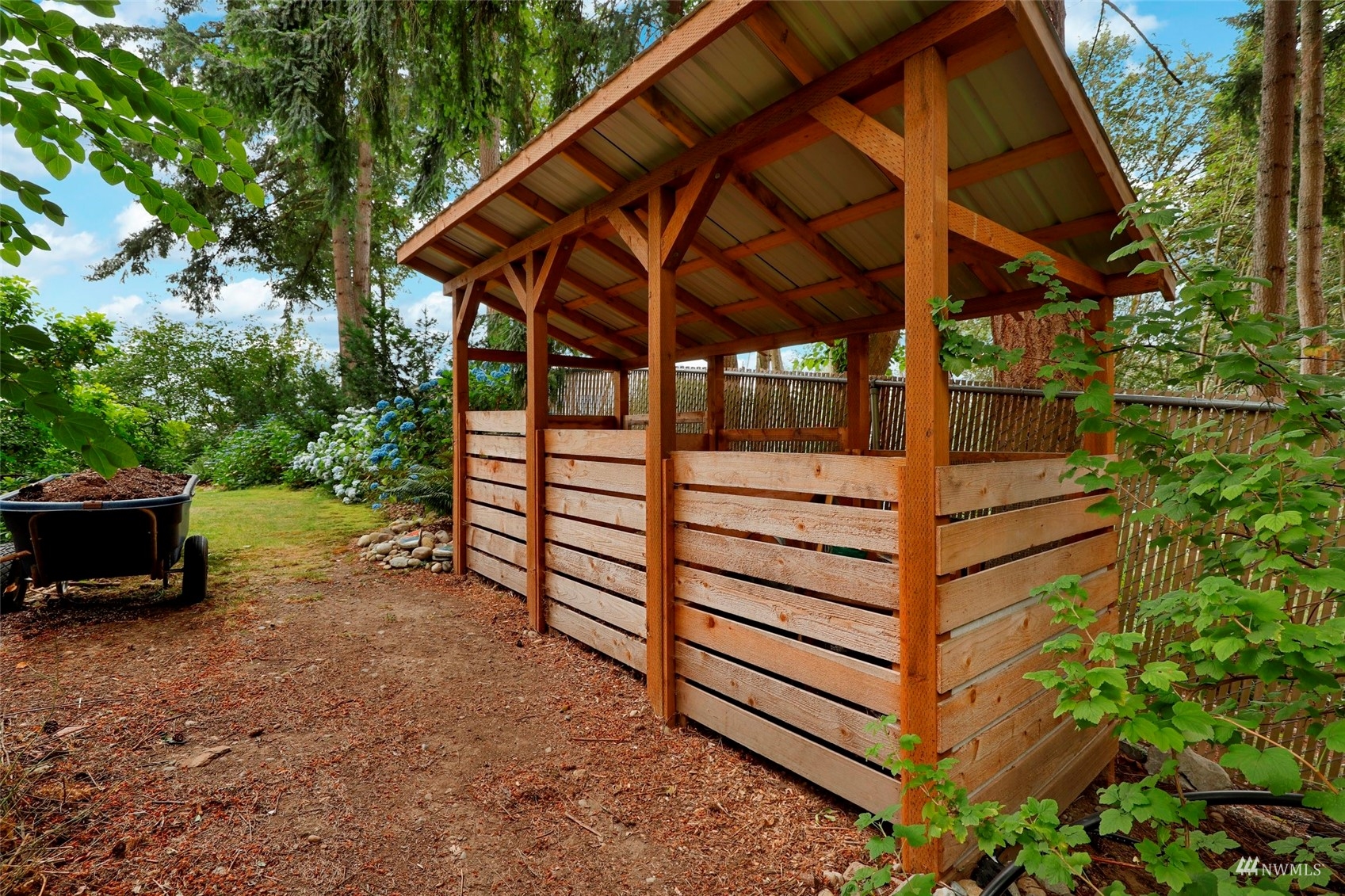 24301 23rd Avenue West Bothell, WA 98021 - Photo 34 of 39 a view of a backyard with a tub and wooden fence