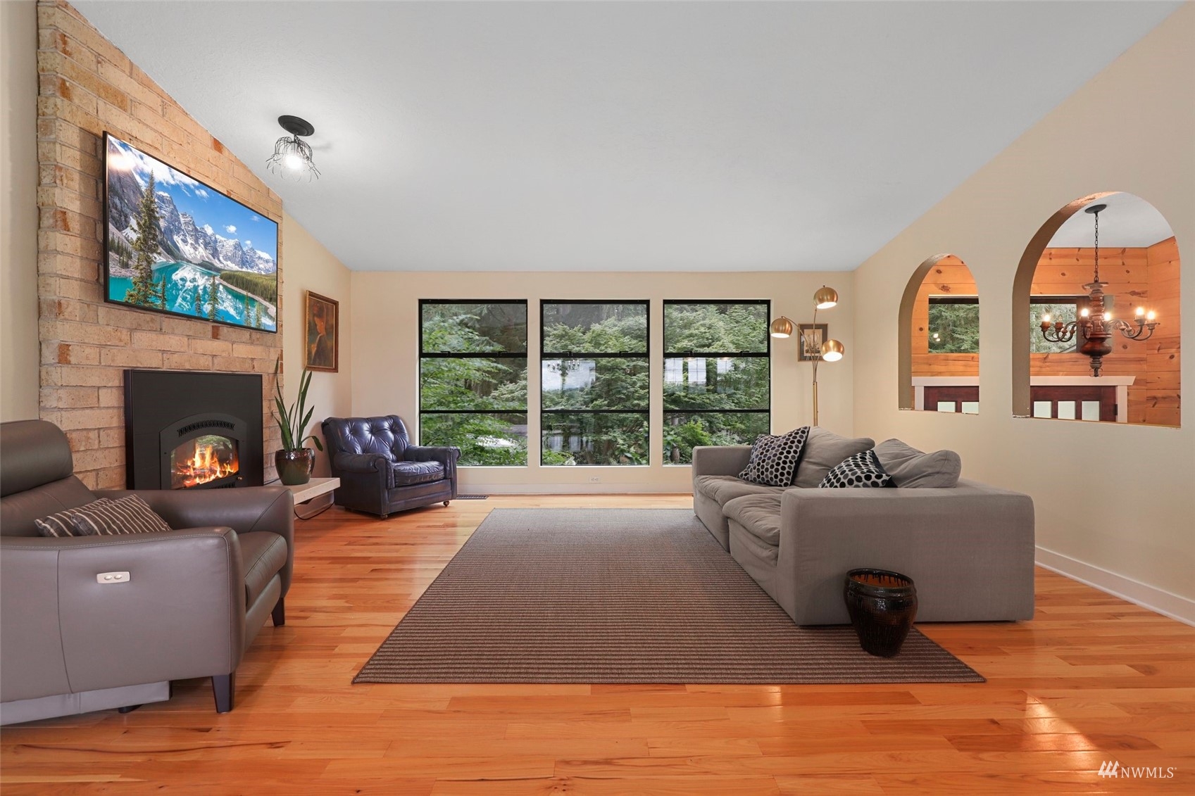 24301 23rd Avenue West Bothell, WA 98021 - Photo 6 of 39 a living room with furniture and a fireplace