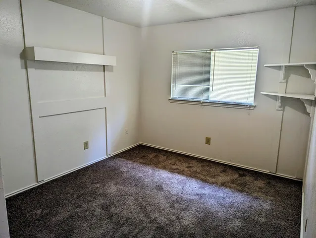 a view of a room that has a window in it