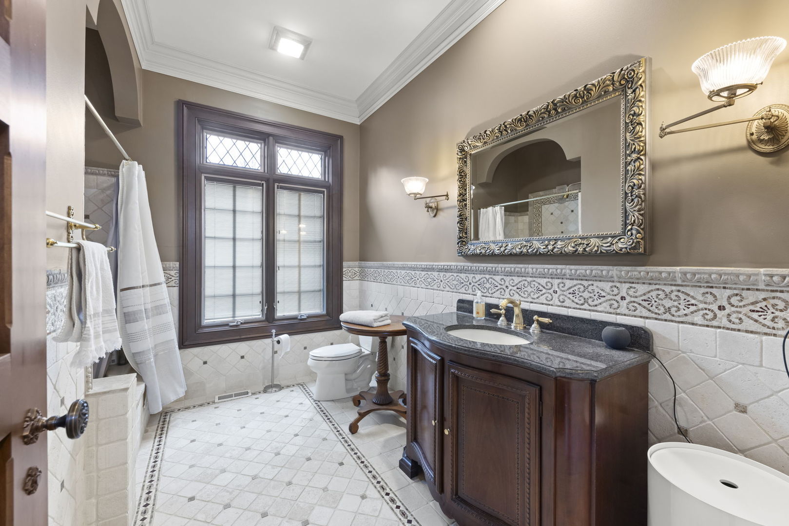 24W141 Hobson Road Naperville, IL 60540 - Photo 43 of 70 a bathroom with a sink and a mirror