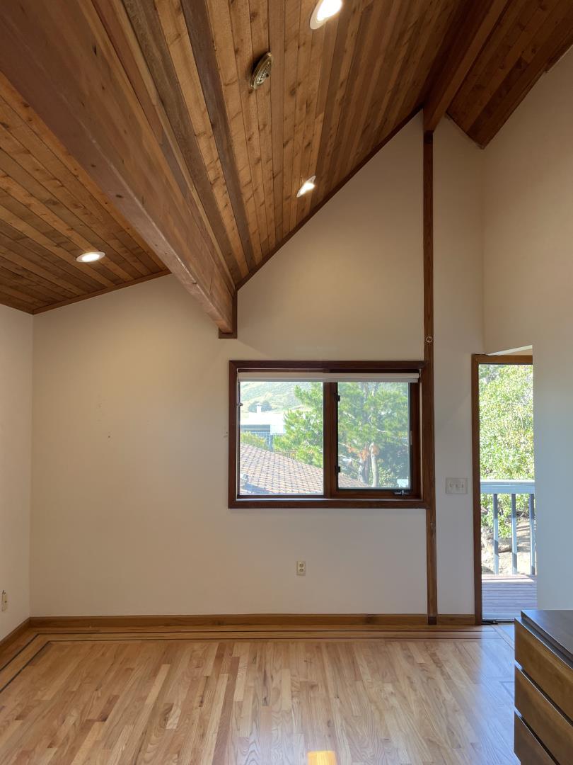 490 Talbot Avenue Pacifica, CA 94044 - Photo 7 of 12 a view of an empty room with wooden floor and a window