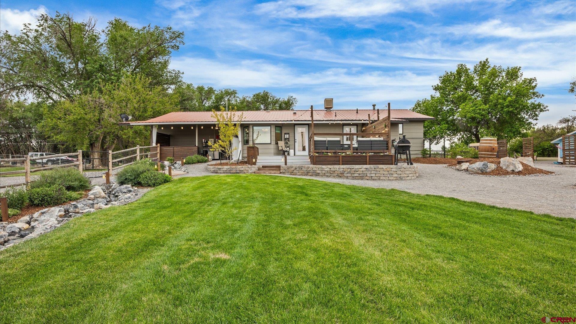 1761 G Road Delta, CO 81416 - Photo 35 of 43 a view of a patio with table and chairs under an umbrella