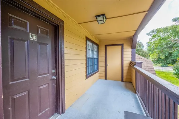 a view of a porch with wooden floor and outdoor space