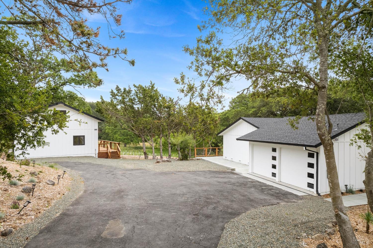 19129-19131 Spring Drive Sonoma, CA 95476 - Photo 17 of 29 a view of a house with a tree in the background