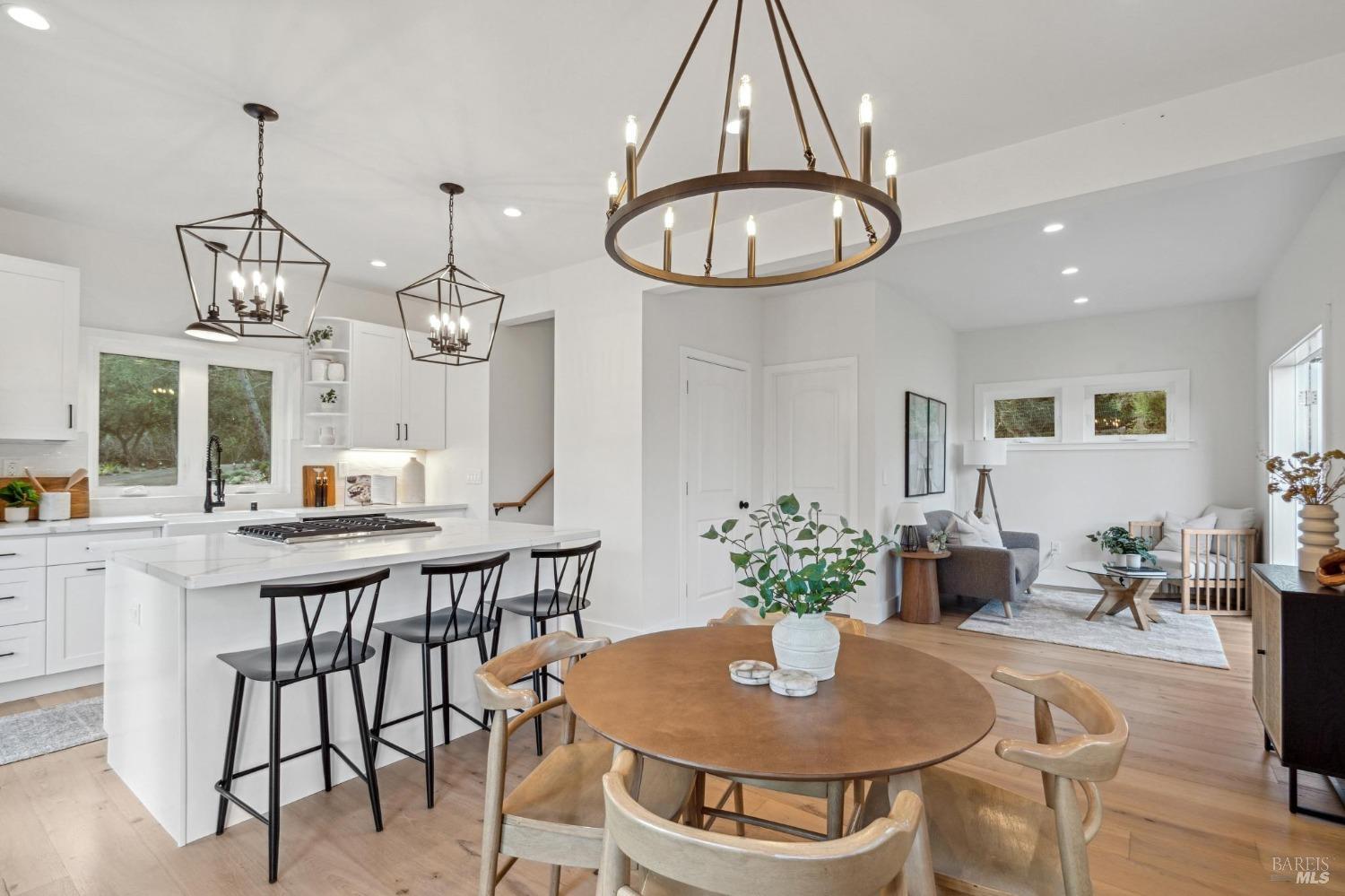 19129-19131 Spring Drive Sonoma, CA 95476 - Photo 18 of 29 a view of a dining room with furniture wooden floor and chandelier