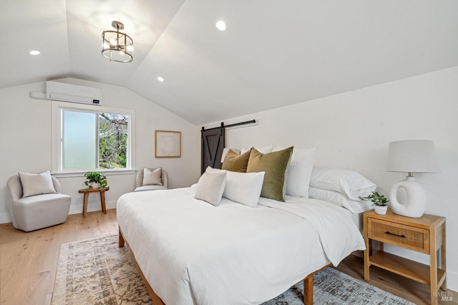 19129-19131 Spring Drive Sonoma, CA 95476 - Photo 22 of 29 a bedroom with a bed and a couch