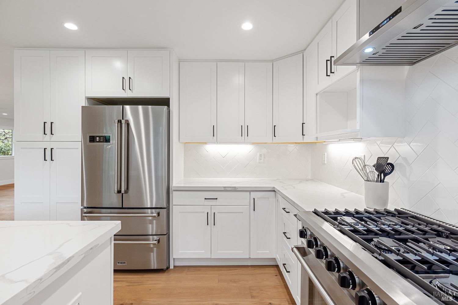 19129-19131 Spring Drive Sonoma, CA 95476 - Photo 9 of 29 a kitchen with granite countertop a stove and a refrigerator