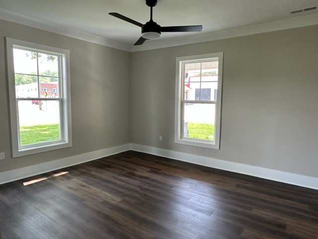 10267 Viola Road Morrison, TN 37357 - Photo 11 of 34 a view of an empty room with wooden floor and a window