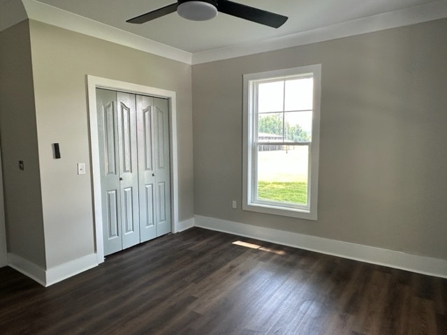10267 Viola Road Morrison, TN 37357 - Photo 12 of 34 a view of an empty room with wooden floor and a window