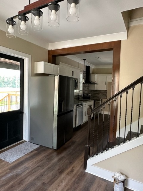 10267 Viola Road Morrison, TN 37357 - Photo 19 of 34 a kitchen with stainless steel appliances kitchen island granite countertop a refrigerator a stove and a microwave with wooden floor