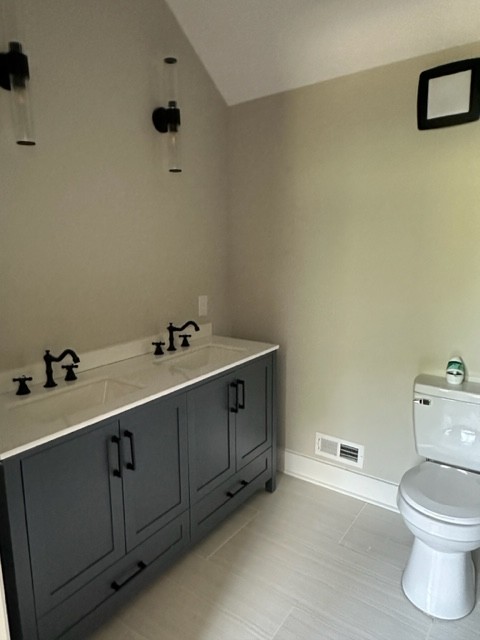 10267 Viola Road Morrison, TN 37357 - Photo 24 of 34 a bathroom with a toilet sink and mirror