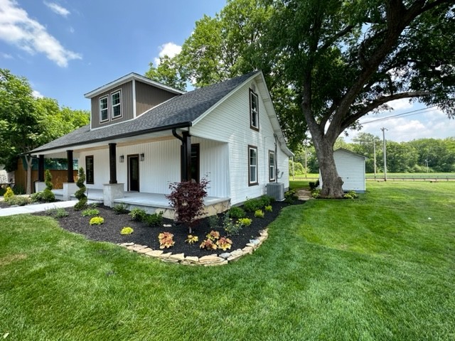 10267 Viola Road Morrison, TN 37357 - Photo 3 of 34 a front view of house with a garden and patio