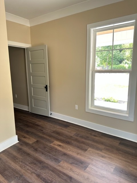 10267 Viola Road Morrison, TN 37357 - Photo 32 of 34 a view of an empty room with wooden floor and a window