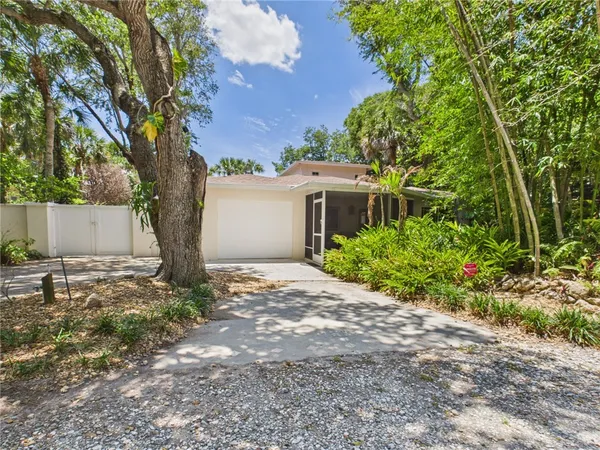 a house with a tree in front of it