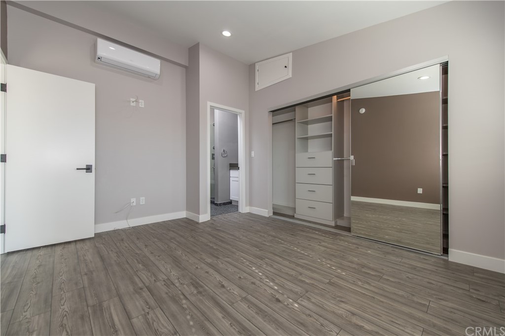 5 Clipper Road, Unit B Rancho Palos Verdes, CA 90275 - Photo 14 of 20 an empty room with wooden floor & closet area