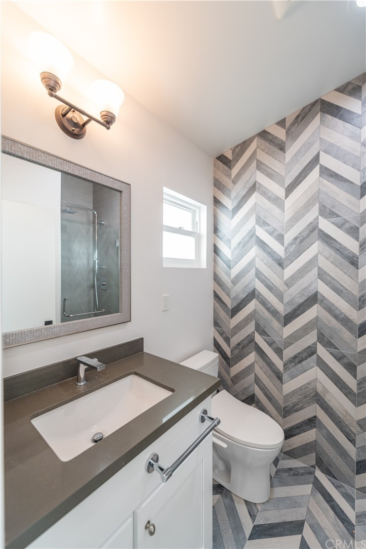 5 Clipper Road, Unit B Rancho Palos Verdes, CA 90275 - Photo 19 of 20 a bathroom with a sink and a mirror
