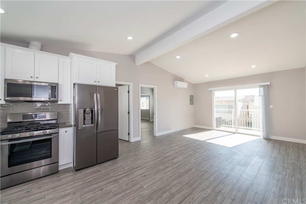 5 Clipper Road, Unit B Rancho Palos Verdes, CA 90275 - Photo 9 of 20 a view of a kitchen with a stove fridge and wooden floor