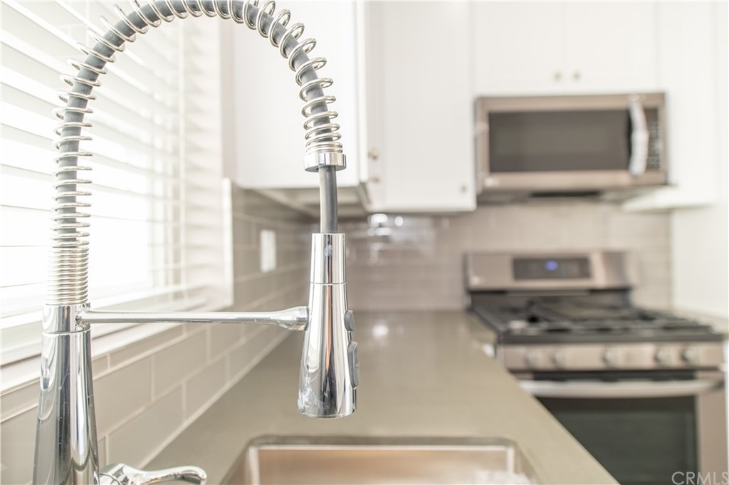5 Clipper Road, Unit B Rancho Palos Verdes, CA 90275 - Photo 10 of 20 a kitchen with a sink and a microwave
