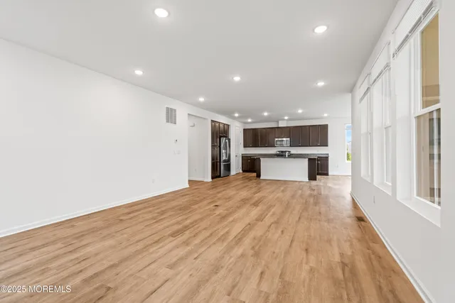 a kitchen with stainless steel appliances granite countertop a refrigerator sink and cabinets