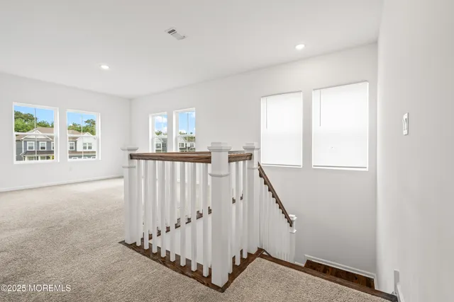 a bathroom with a double vanity sink mirror and shower