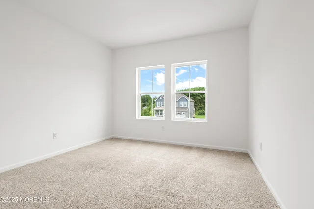 a view of a hallway with wooden floor and a hallway