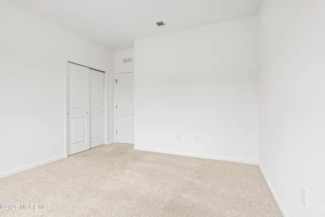 a view of a closet area with cabinet