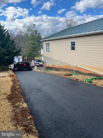 a view of a car in front of a house