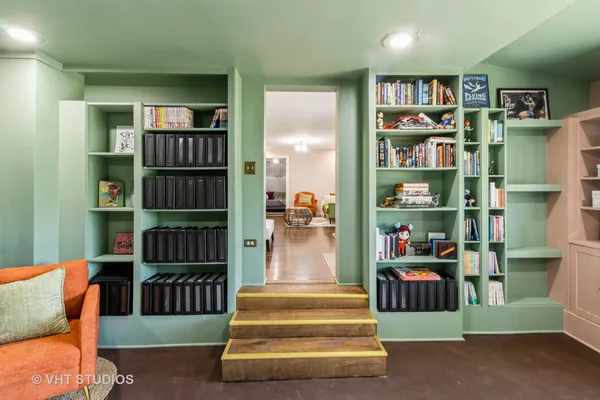 a view of a livingroom with furniture and staircase
