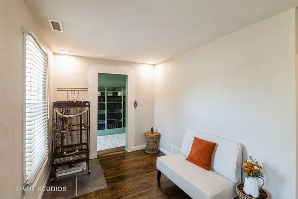 a room with furniture and wooden floor