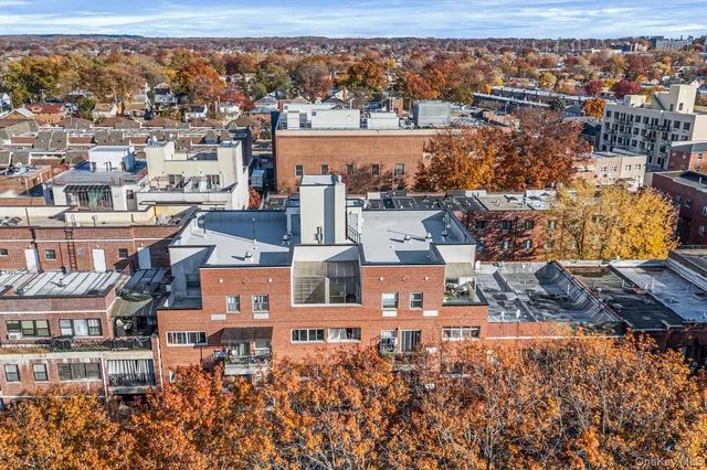 an aerial view of a city with lots of residential buildings