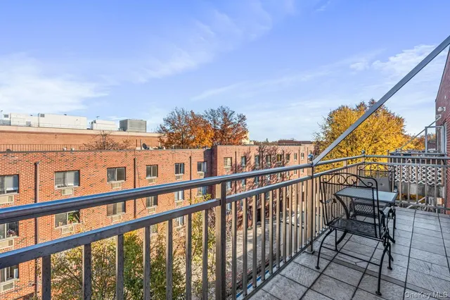 a view of a balcony with furniture